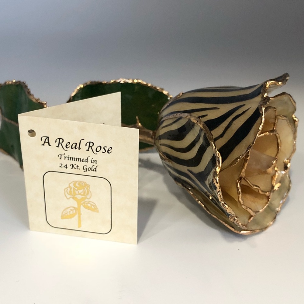 Beautiful cream color zebra print gold dipped rose